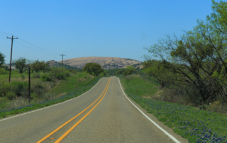 A picture of a Texas Hill Country road during a road trip